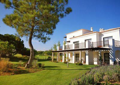 white luxury villa, lawn and pine